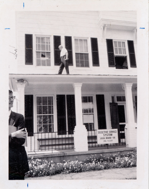 Photograph of broken window in Selective Service office